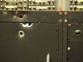 WISC Computer with bullet holes.jpg